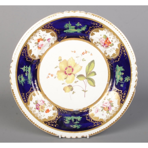 25 - A Rockingham dessert plate hand painted with floral sprays with cobalt blue and gilt borders. Puce G... 