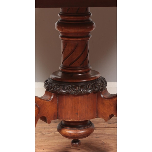 264 - A Victorian walnut tilt top supper table with quarter veneered top and raised on carved tripod suppo... 