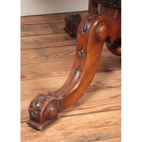 264 - A Victorian walnut tilt top supper table with quarter veneered top and raised on carved tripod suppo... 