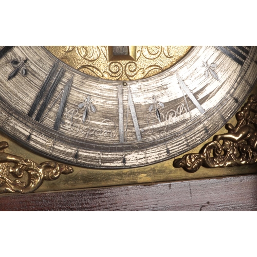 269 - A Georgian mahogany longcase clock. Having twin swan neck pediments, carved lion detail and satinwoo... 