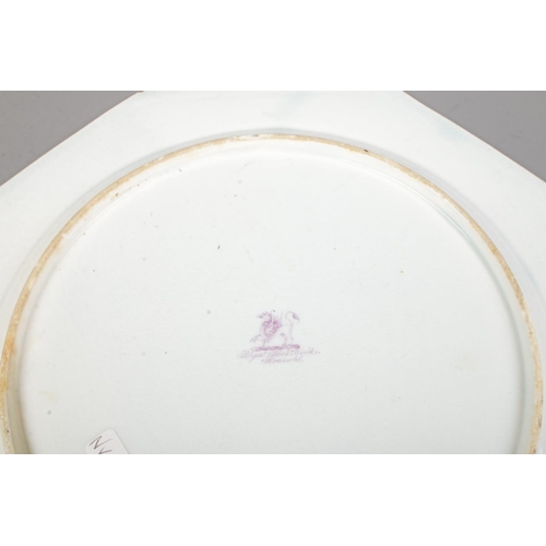 27 - A Rockingham octagonal plate decorated in the famille vert palette with birds and peonies. Diameter ... 