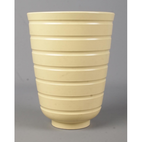 41 - A Wedgwood pottery vase of ribbed form designed by Keith Murray. Height 18.5cm.