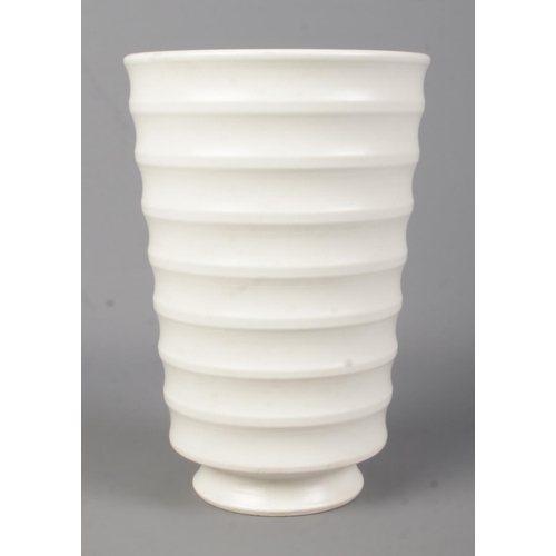 42 - A Wedgwood pottery vase of ribbed form designed by Keith Murray. 18cm.