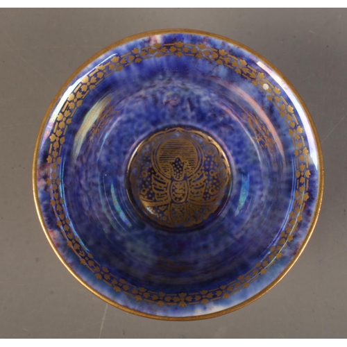 45 - A Wedgwood Lustre miniature bowl by Daisy Makeig Jones, decorated with motifs. Having mottled orange... 