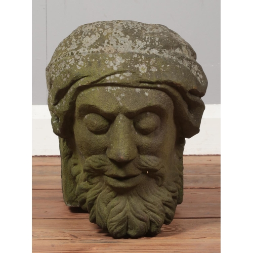 55 - A carved stone corbel, formed as the bust of a gentleman. Length 51cm, Height 28cm.