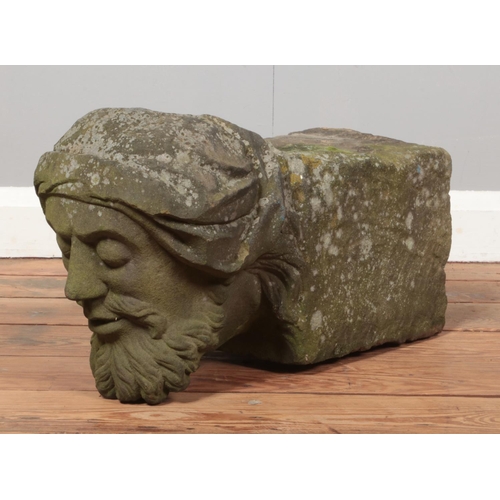 55 - A carved stone corbel, formed as the bust of a gentleman. Length 51cm, Height 28cm.