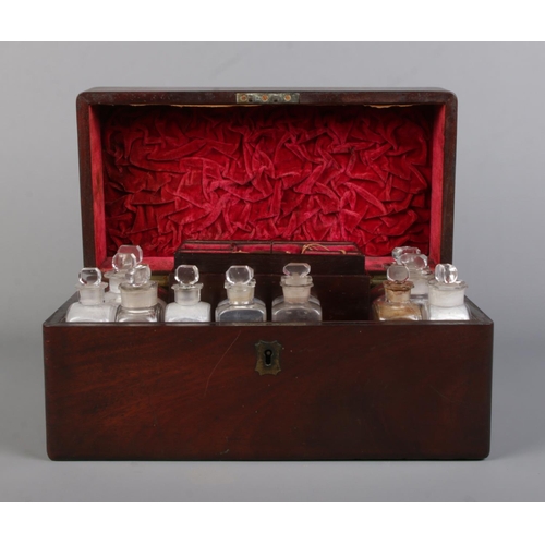 62 - An early 19th century mahogany apothecary box with contents of glass medicine and poison bottles. 16... 