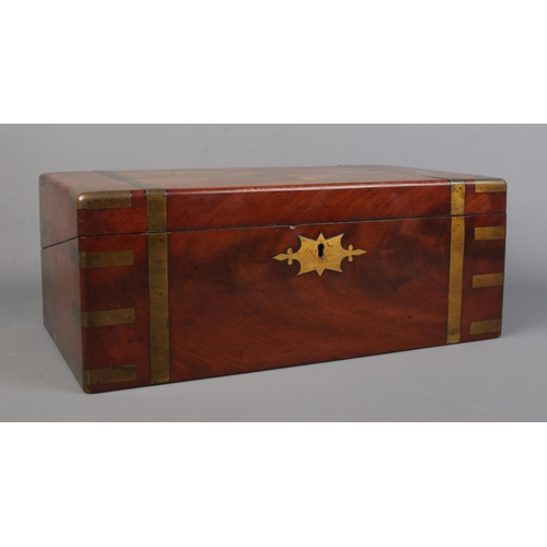 65 - A Victorian brass bound mahogany writing box.