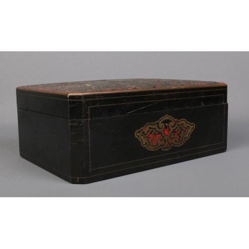 66 - A 19th century Boulle work box with hinged lid. 11cm x 28cm x 20cm.