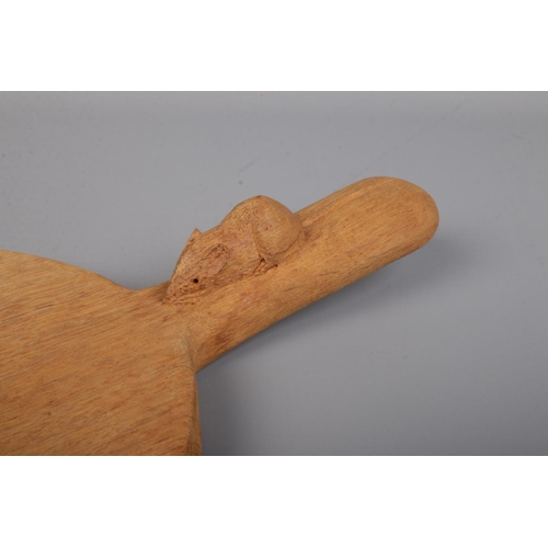 67 - Robert 'Mouseman' Thompson, an oak cheese board with handle and signature mouse carving. Length 39.5... 