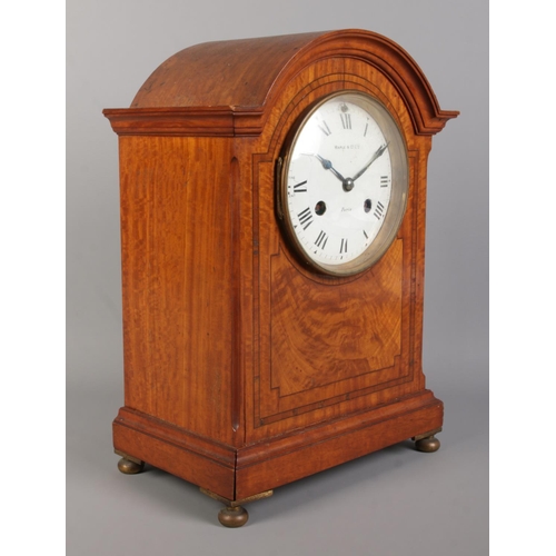 71 - A Maple & Co Ltd. mahogany eight day bracket clock. Having enamel dial, Roman numeral markers and ch... 