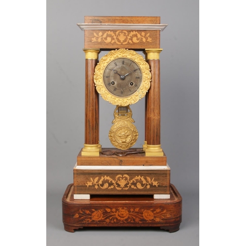 72 - A 19th century French inlaid rosewood Portico clock. Height on stand 47.5cm.