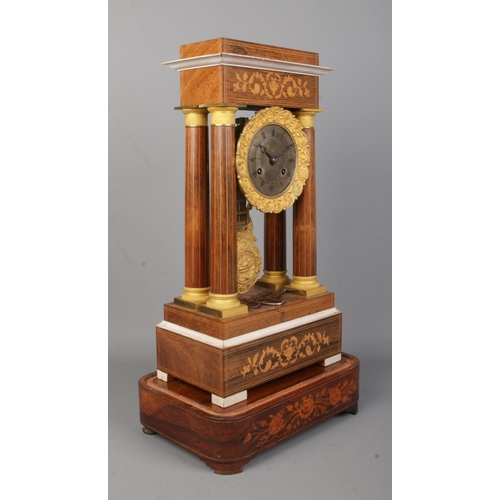 72 - A 19th century French inlaid rosewood Portico clock. Height on stand 47.5cm.