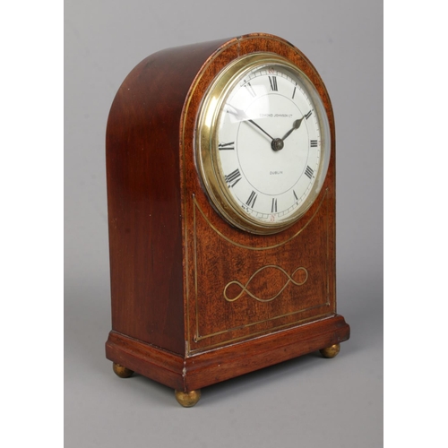 73 - A small Edwardian brass inlaid mahogany dome top mantel clock. The dial marked for Edmond Johnson Lt... 