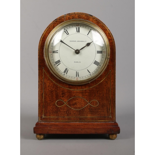 73 - A small Edwardian brass inlaid mahogany dome top mantel clock. The dial marked for Edmond Johnson Lt... 