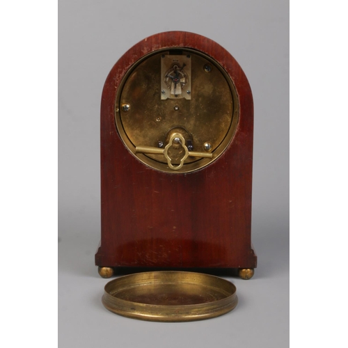 73 - A small Edwardian brass inlaid mahogany dome top mantel clock. The dial marked for Edmond Johnson Lt... 