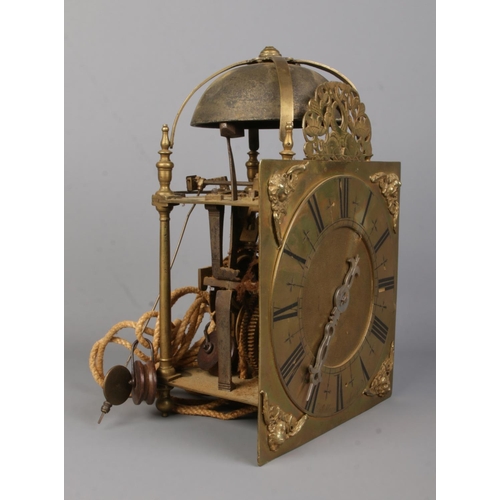 74 - An early 19th century brass lantern clock by Joshua Allsopp, East Smithfield. Height 33cm.