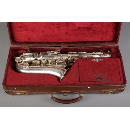 77 - An early 20th century French silver plated saxophone by Couesnon & Cie. In case.