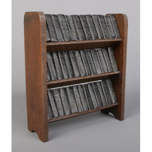 89 - A miniature bookshelf with contents of Allied Newspaper Ltd William Shakespeare volumes. Bookshelf 2... 