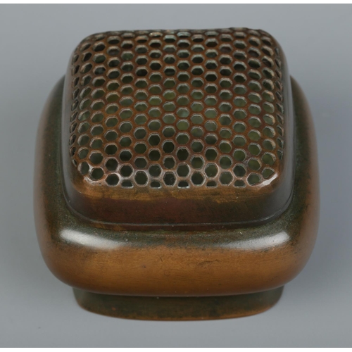 9 - A Chinese bronze hand warmer of square form, having pierced cover. Character marks to base. 5.5cm x ... 