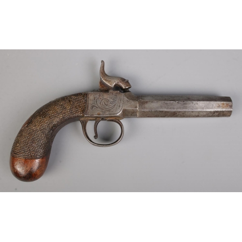 94 - A 19th century percussion cap pistol with octagonal screw off barrel. Length 18cm. CANNOT POST OVERS... 