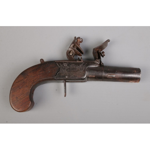 96 - A 19th century flint lock pistol with cylindrical barrel and pull down trigger. Makers mark for W Yo... 