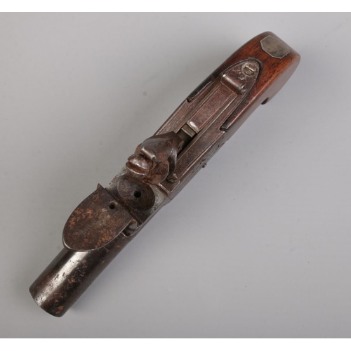 96 - A 19th century flint lock pistol with cylindrical barrel and pull down trigger. Makers mark for W Yo... 