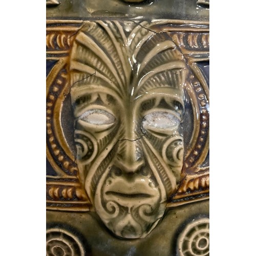 44 - An early 20th century Royal Doulton Maori Ware glazed stoneware jardiniere. Decorated with mask and ... 