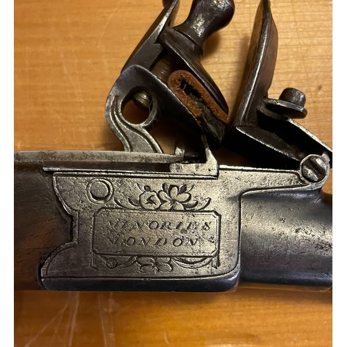 106 - An early 19th century flintlock pocket pistol. Having pull down trigger and screw off barrel. The lo... 