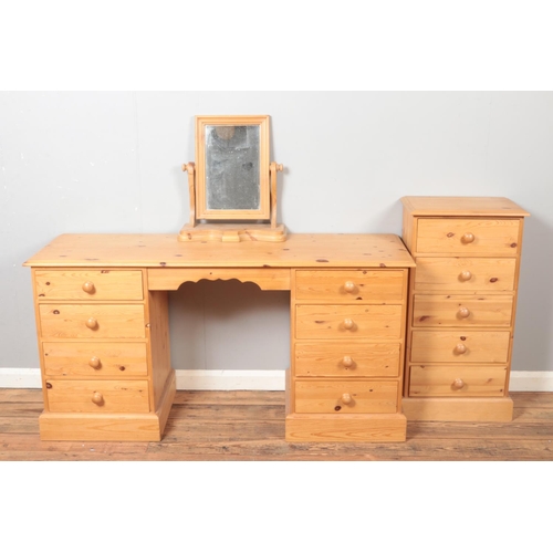 583 - A pine dressing table/twin pedestal desk featuring four drawers to both sides, together with a table... 