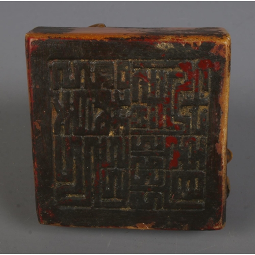 280 - A decorative seal stamp formed as a seated monkey featuring character marks to base. Approx. height ... 