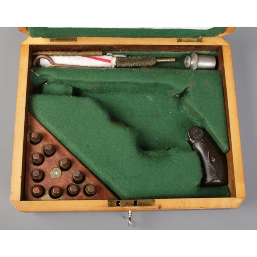 330 - An oak pistol box fashioned for a Smith & Wesson double action revolver. With grip, inert rounds and... 