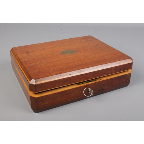 330 - An oak pistol box fashioned for a Smith & Wesson double action revolver. With grip, inert rounds and... 