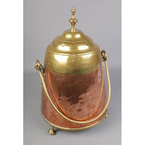 344 - A Victorian copper and brass lidded coal/peat bucket with swing handle.