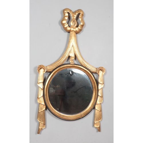 464 - An antique gilt framed mirror of Neo Classical design. Length 124cm.