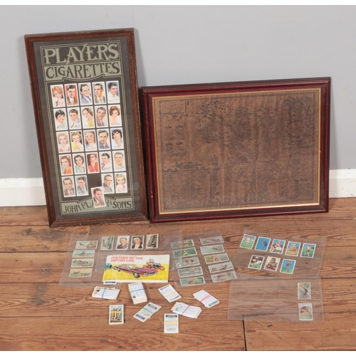 468 - A collection of assorted cigarette cards to include Players, Brooke Bond, etc. Along with a framed m... 