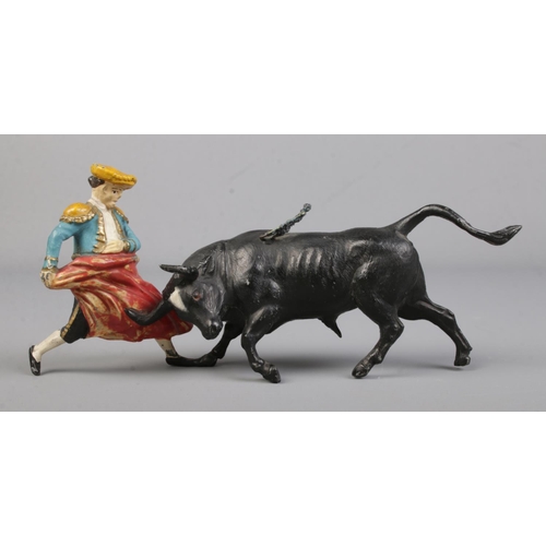 475 - A cold painted spelter figure of a matador fighting a bull.

Length 16.5cm approx