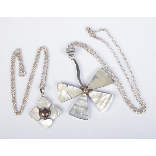 489 - Two silver and mother of pearl necklaces formed as flowers. Approx. total weight 45.3g.