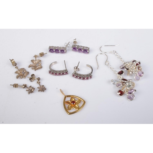 499 - A collection of silver jewellery, mainly earrings, to include six stone garnet, three stone amethyst... 