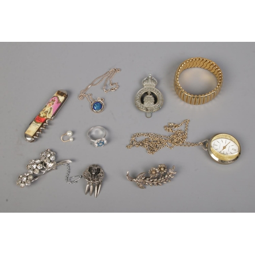 535 - A collection of mostly costume jewellery to include brooches, floral ring, pendant on chain stamped ... 