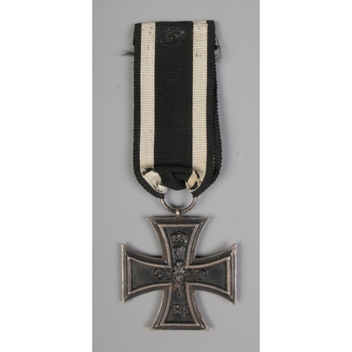 546 - An Imperial German Military First World War iron cross medal with ribbon.