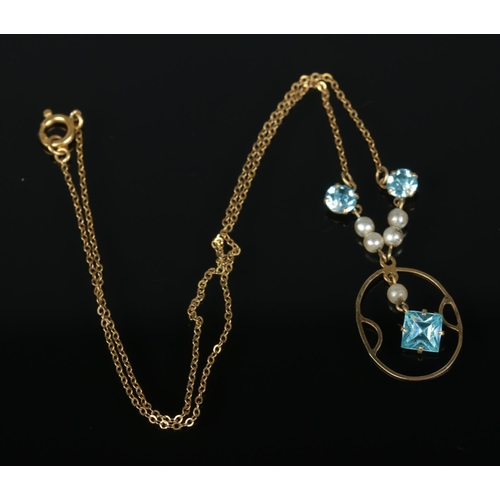 551 - A 9ct gold Edwardian style pendant on chain featuring simulated pearls and three blue paste stones. ... 