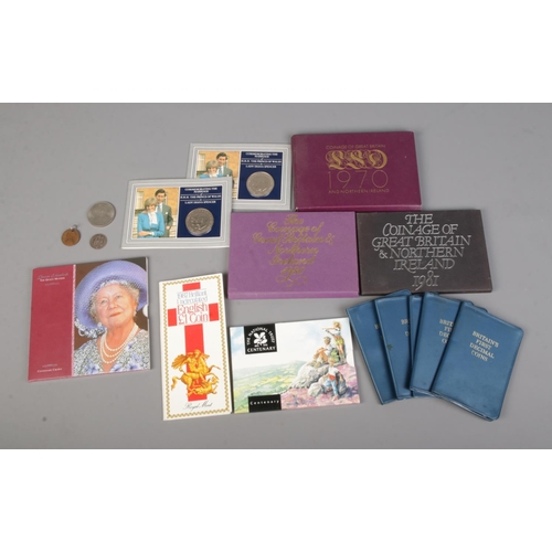 561 - A collection of British commemorative coin packs to include Coinage of Great Britain and Northern Ir... 