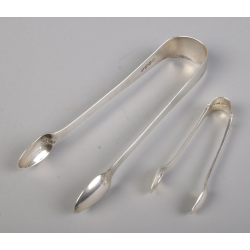 582 - A pair of silver George IV sugar tongs assayed London 1822, Sarah & John William Blake. together wit... 