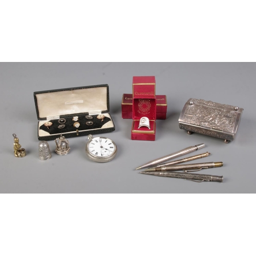 368 - A quantity of assorted collectables,  to include cased set of shirt studs, white metal pocket watch,... 