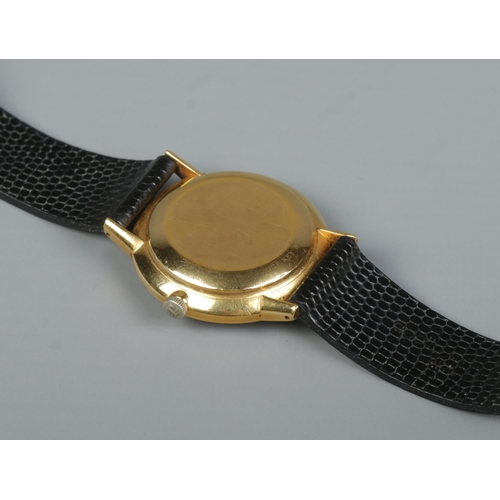 520 - A Gents yellow metal Tissot Automatic Seastar Seven wristwatch on black Apollo strap. In soft shell ... 