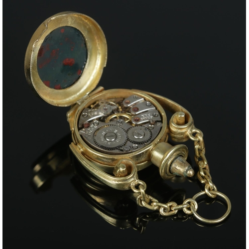 521 - A yellow metal fob watch, housing Buren Grand Prix 15 jewel movement. Set with a bloodstone to the b... 