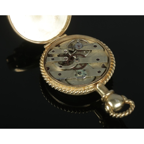 522 - A yellow metal fob watch, with French movement and polished semi-precious and colourless stones moun... 