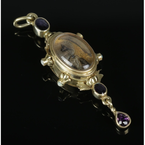 523 - An antique yellow metal pendant fob watch of unusual form set with two opal stones to each side and ... 