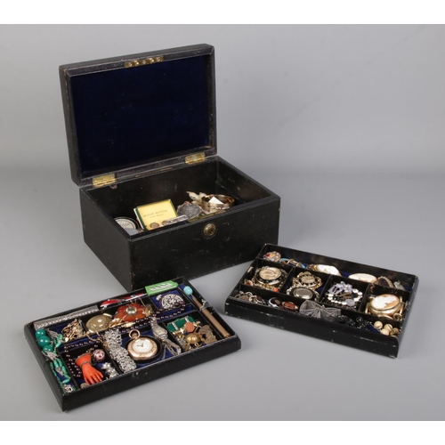 576 - A Parkins and Gotto (Oxford Street) multi-layer jewellery box containing an extremely large quantity... 